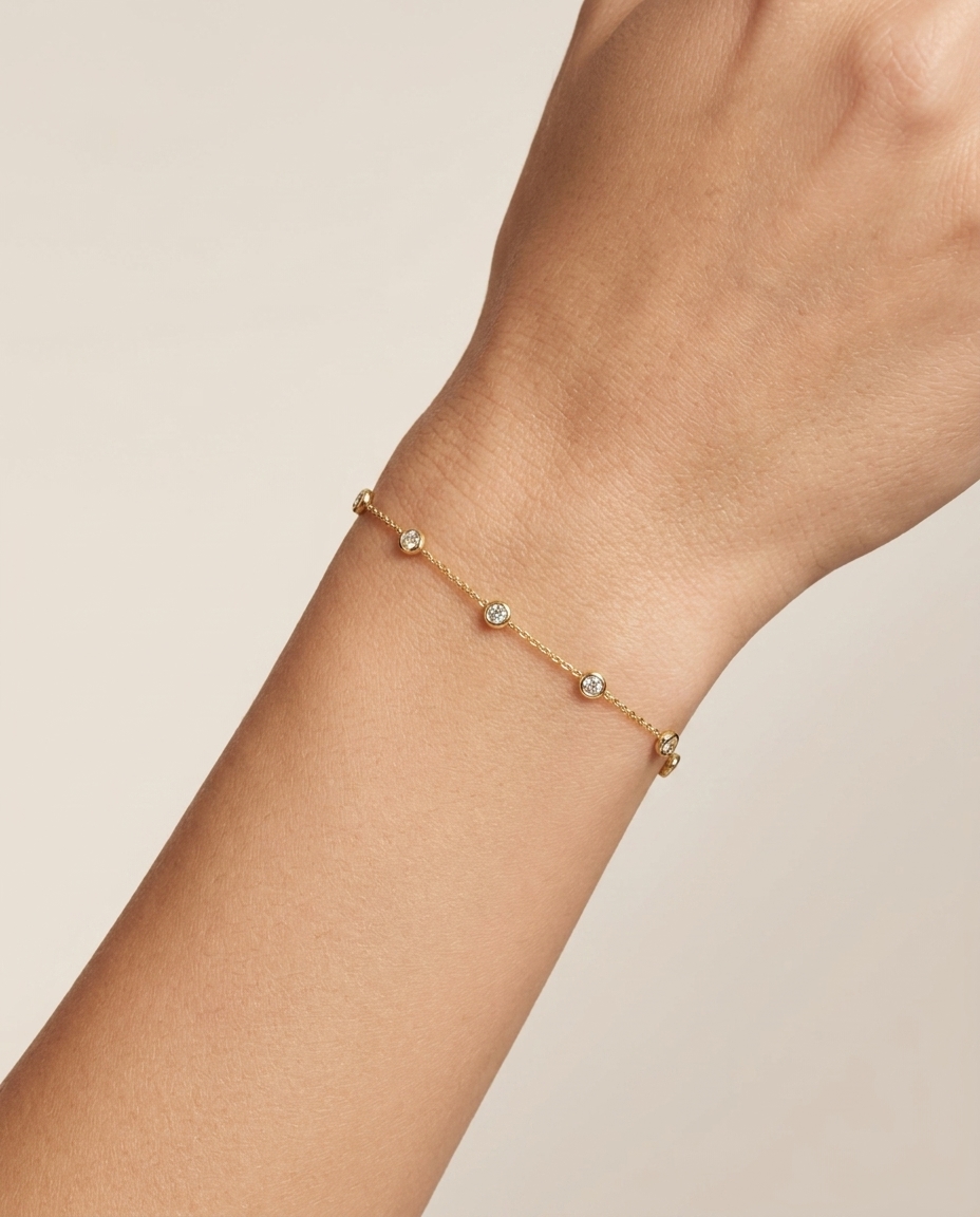 14KT Gold Bezeled Diamond Station Bracelet on model