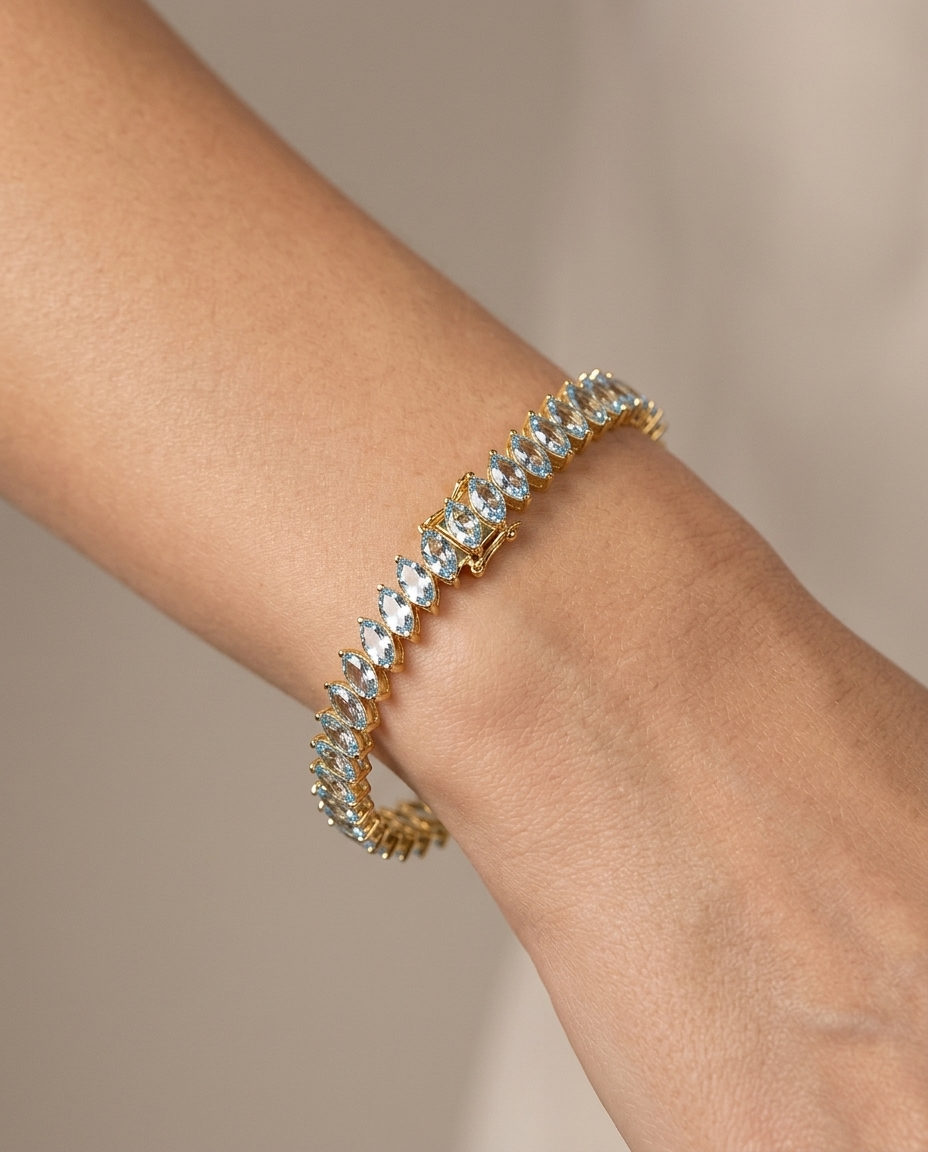 14KT Yellow Gold Marquise Shape Aquamarine Tennis Bracelet on model