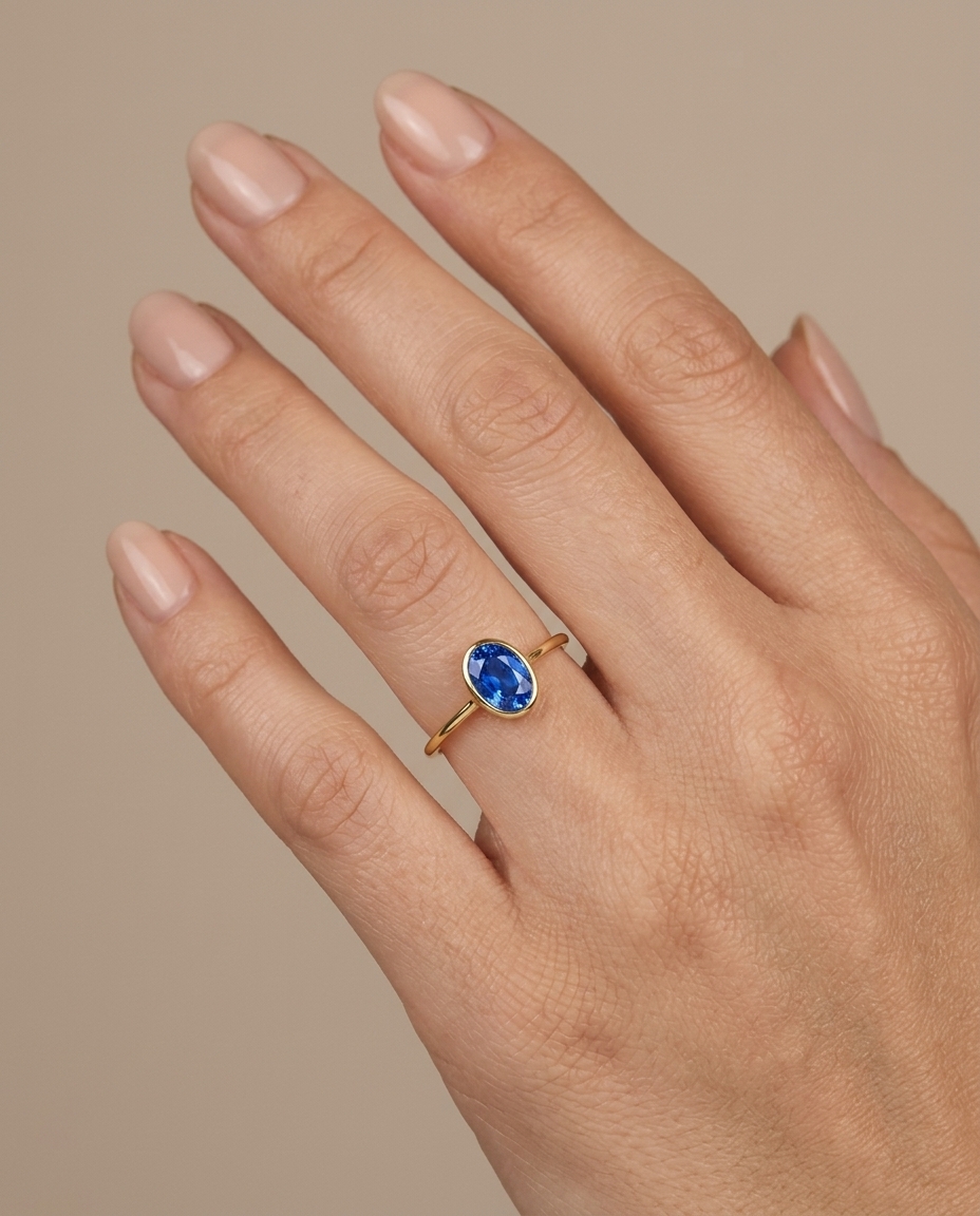 18KT Yellow Gold Blue Sapphire Ring on model