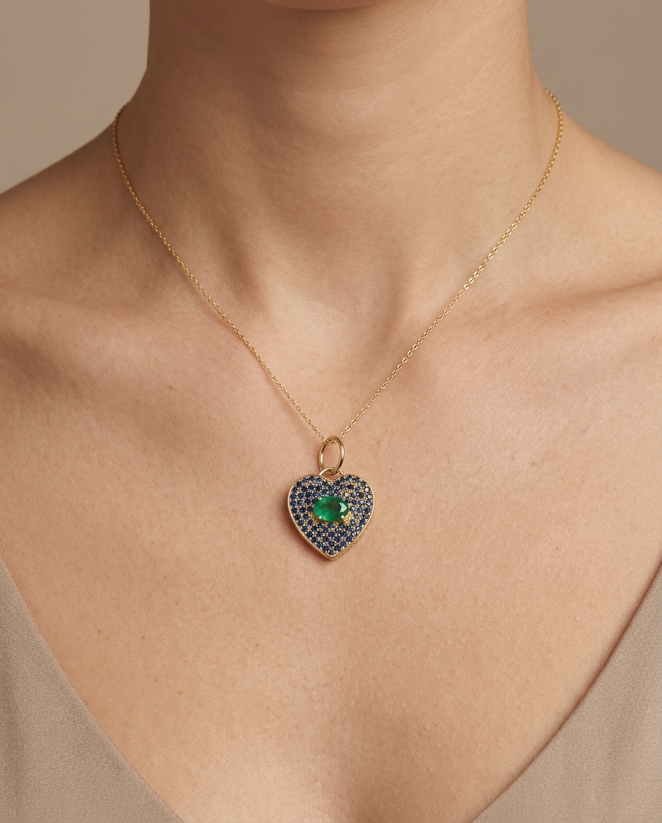 14KT Yellow Gold Sapphire and Emerald Heart Pendant on model
