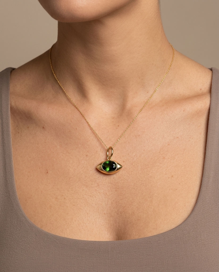 14KT Yellow Gold Green Sapphire Evil Eye Pendant on model