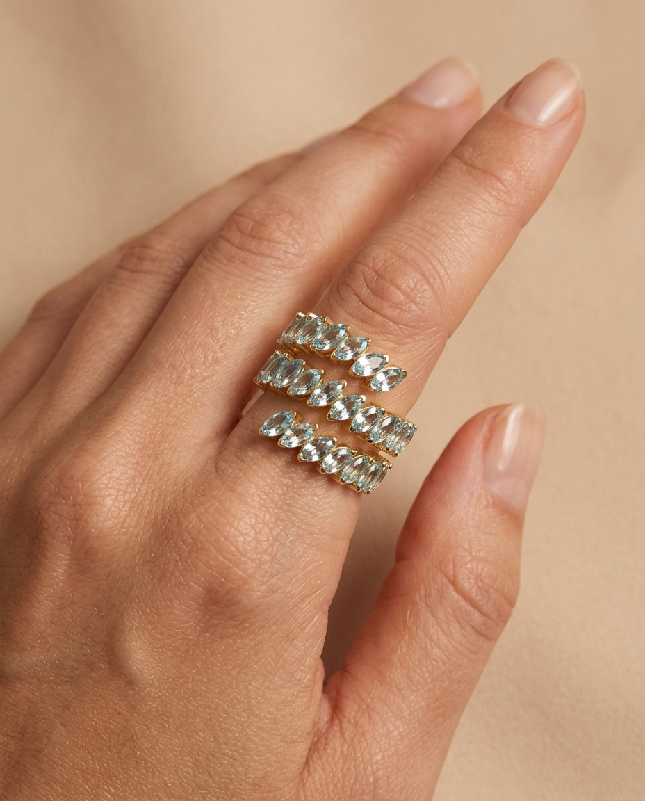 14KT Yellow Gold Marquise Shape Aquamarine Wrap Around Ring on model