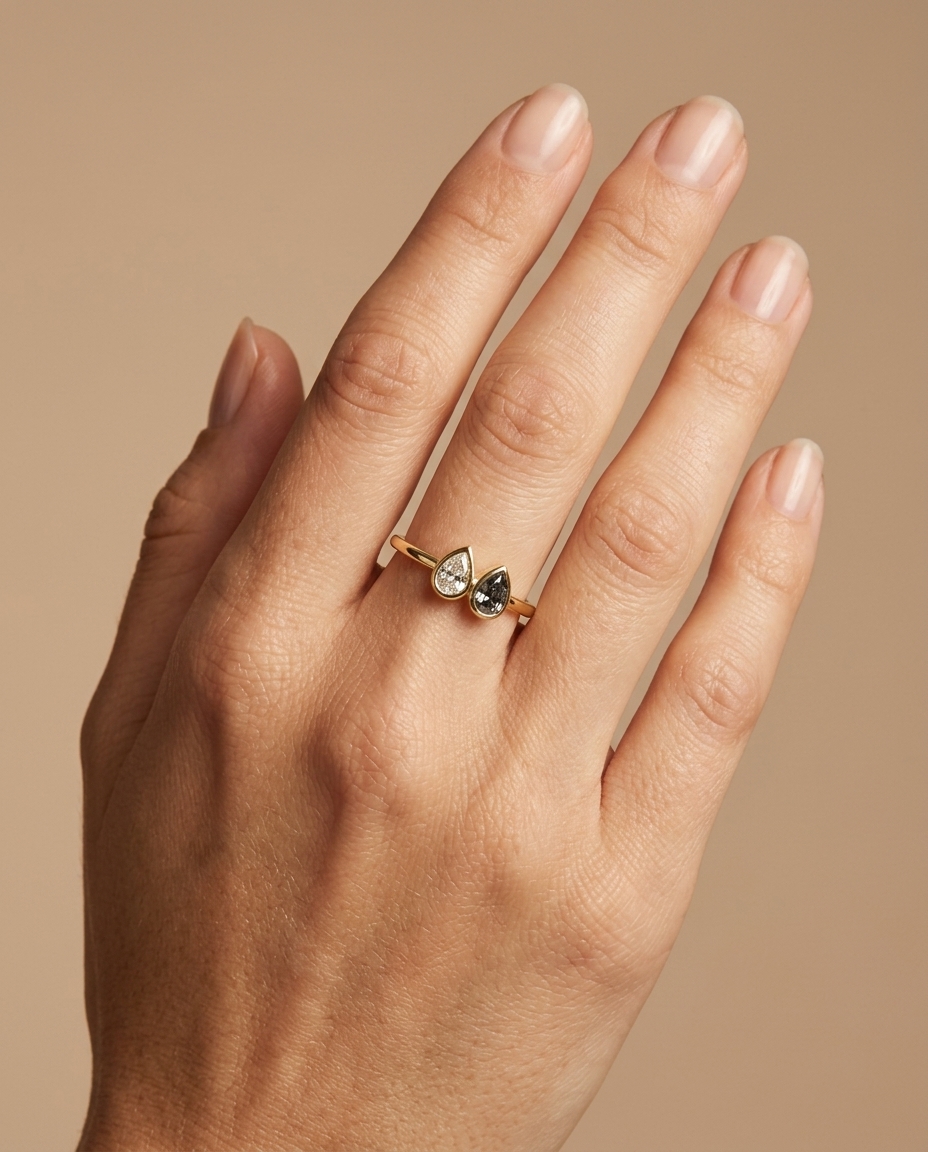 14KT Gold Ring with Single Bezeled Pear Shape Diamond on model
