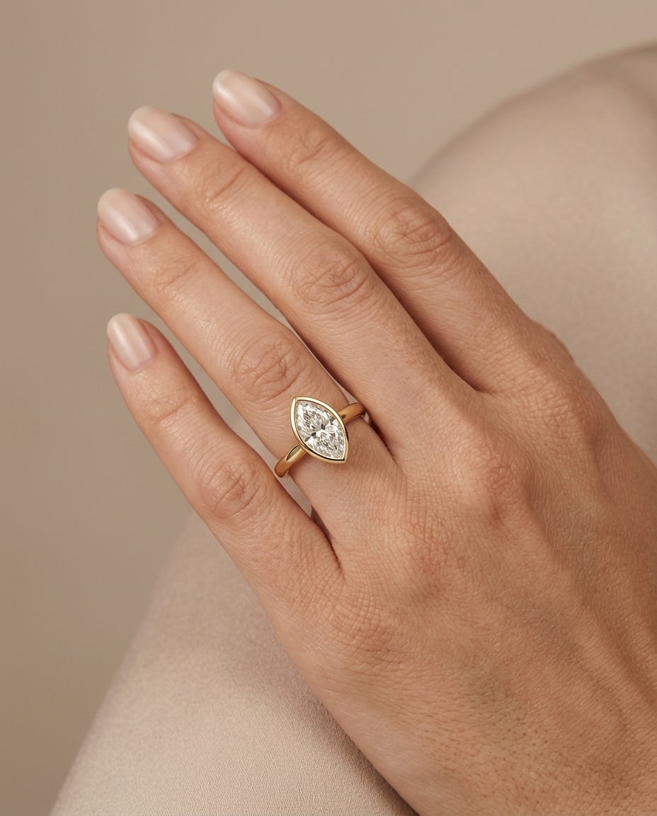 14KT Gold Ring with Single Bezeled Marquise Shape Diamond on model