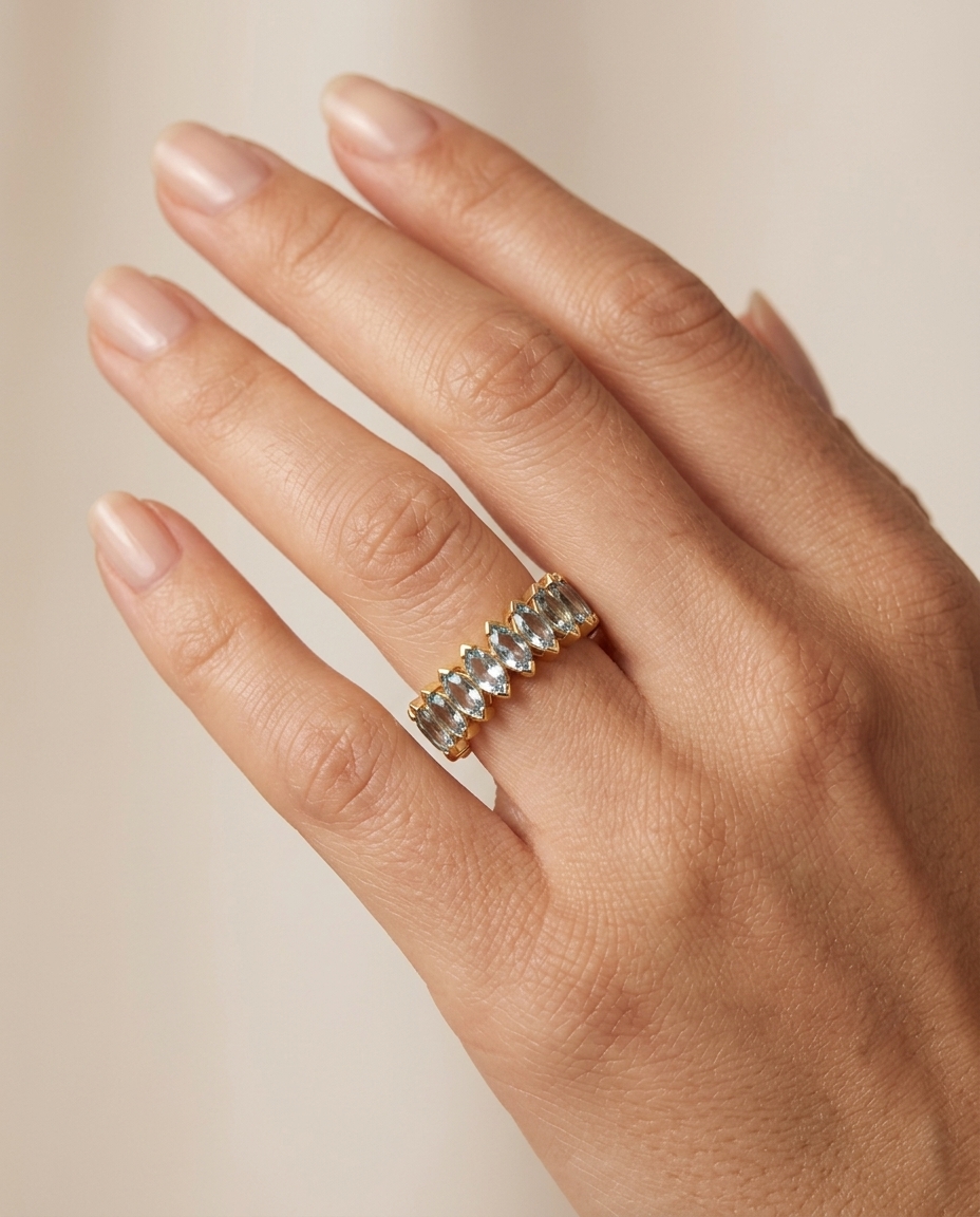 14KT Gold Marquise Shape Aquamarine Eternity Band on model