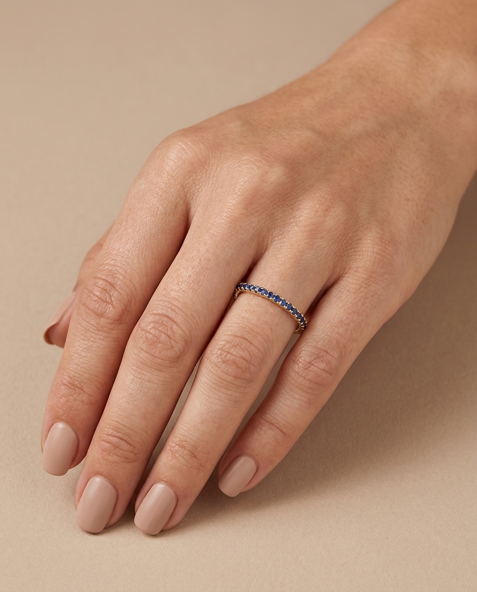 14KT Gold Blue Sapphire Ring Eternity Band on model