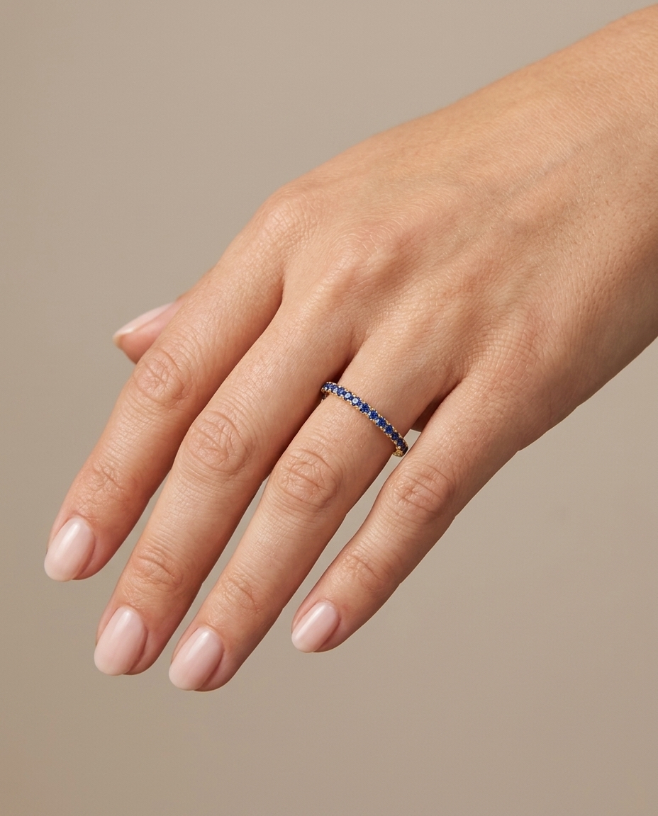 14KT Gold Blue Sapphire Ring Eternity Band on model