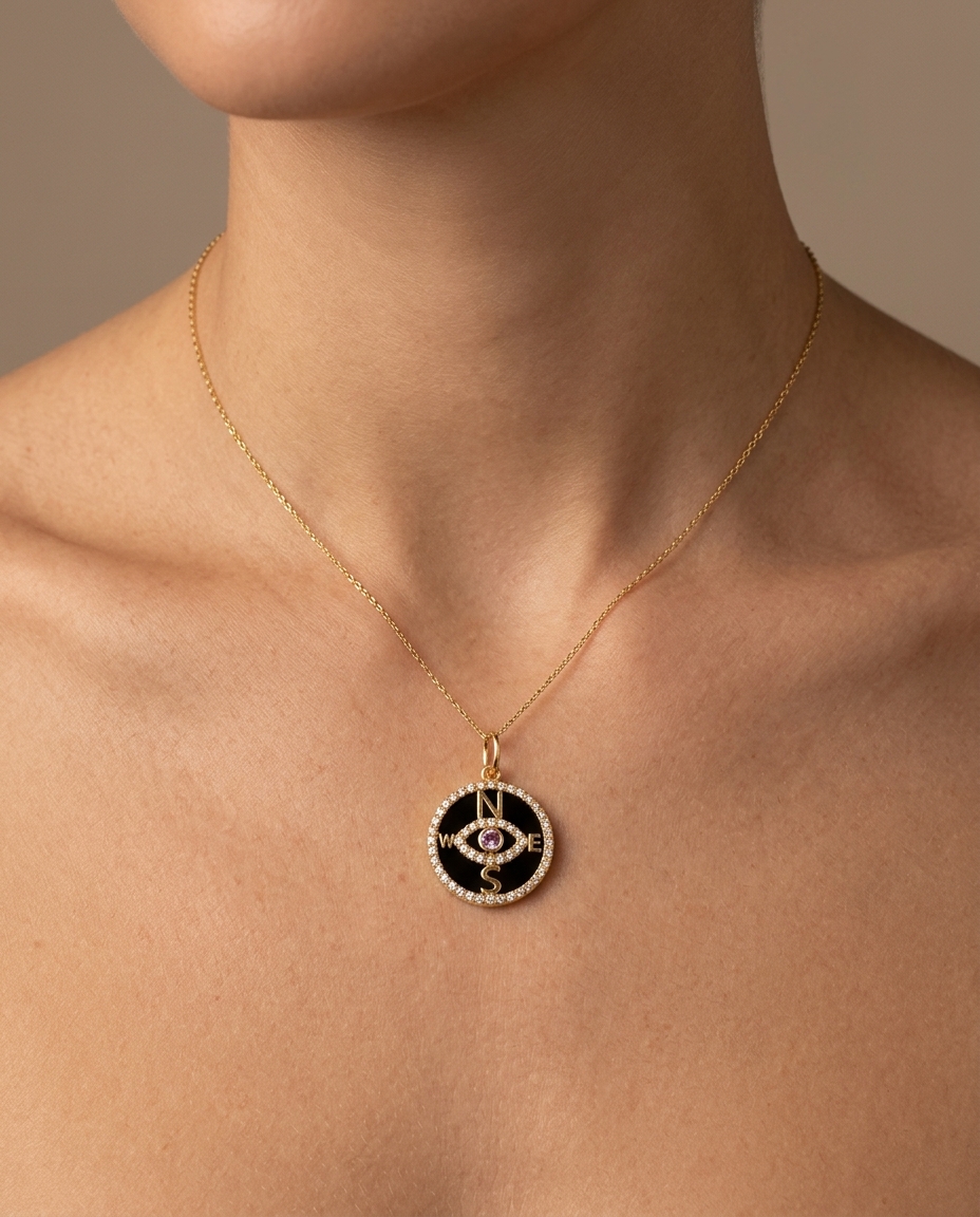 14KT Yellow Gold Black Onyx and Pink Sapphire Evil Eye Compass Pendant with Diamonds on model