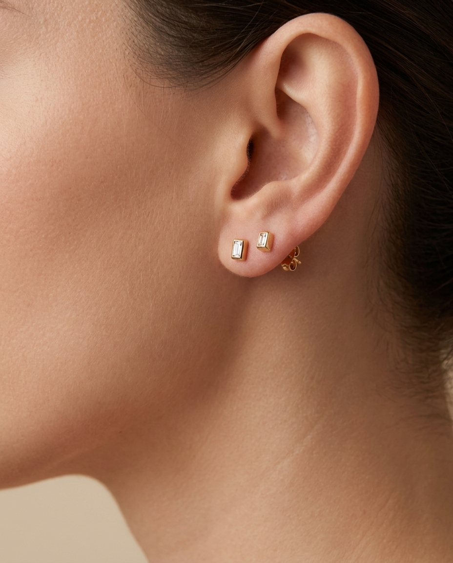 Baguette Bezeled Ear Stud . in Yellow Gold on model